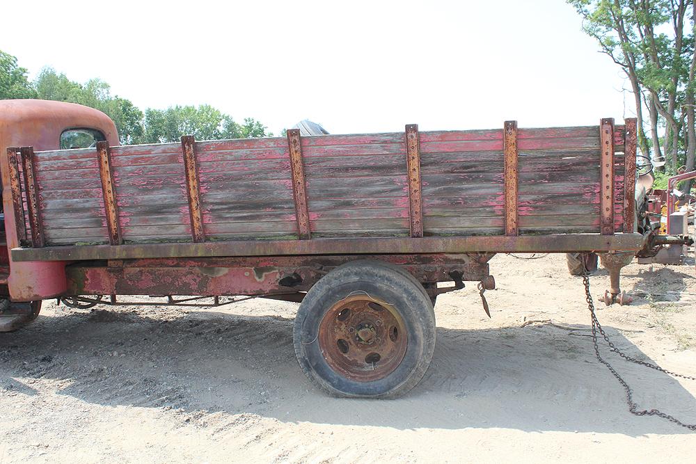 1940'S REO SPEEDWAGON 1.5 TON DUAL WHEELED TRUCK - HOIST, BEEN IN WEEDS FOR A LONG TIME