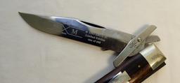 (2) KNIVES A CASE  MUSKRAT 1993 ABCA 1/800 STAG HANDLED FOLDING KNIFE AND A SXM 1993