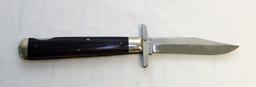 (2) KNIVES A CASE  MUSKRAT 1993 ABCA 1/800 STAG HANDLED FOLDING KNIFE AND A SXM 1993