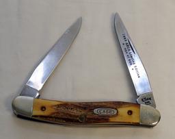 (2) KNIVES A CASE  MUSKRAT 1993 ABCA 1/800 STAG HANDLED FOLDING KNIFE AND A SXM 1993