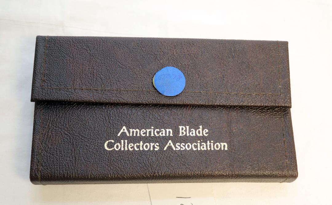 (2) KNIVES A CASE  MUSKRAT 1993 ABCA 1/800 STAG HANDLED FOLDING KNIFE AND A SXM 1993