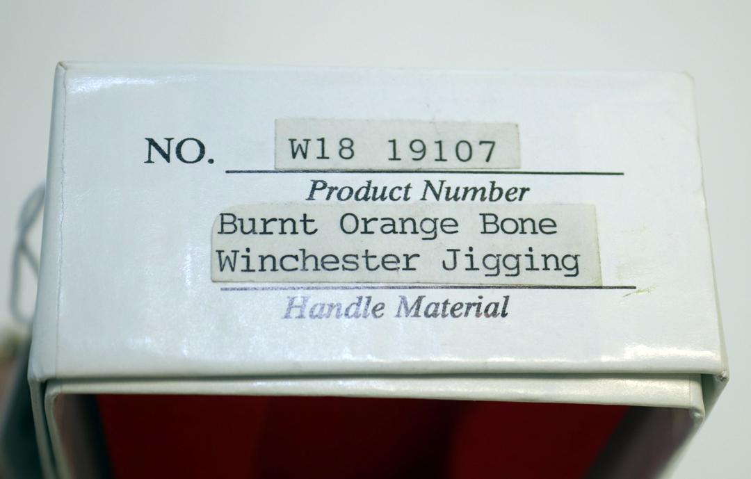 WINCHESTER 19107 BURNT ORANGE JIGGING BONE HANDLED BULLET KNIFE AND BOX