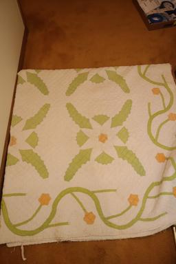 Quilt rack and vintage quilts; quilts show signs of use