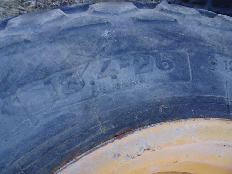 18.4-26 RIMS AND TIRES (4)