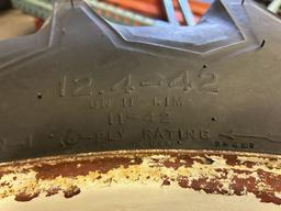 FIRESTONE 12.4-42 TIRES ON 8-BOLT RIMS (2 QTY.)