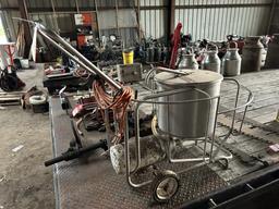 ELECTRIC MILK PUMP WITH STAINLESS CAN ON A CART