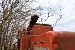 MF combine, salvage- sells w/ partial rack of weights sitting under it