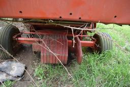 MF combine, salvage- sells w/ partial rack of weights sitting under it