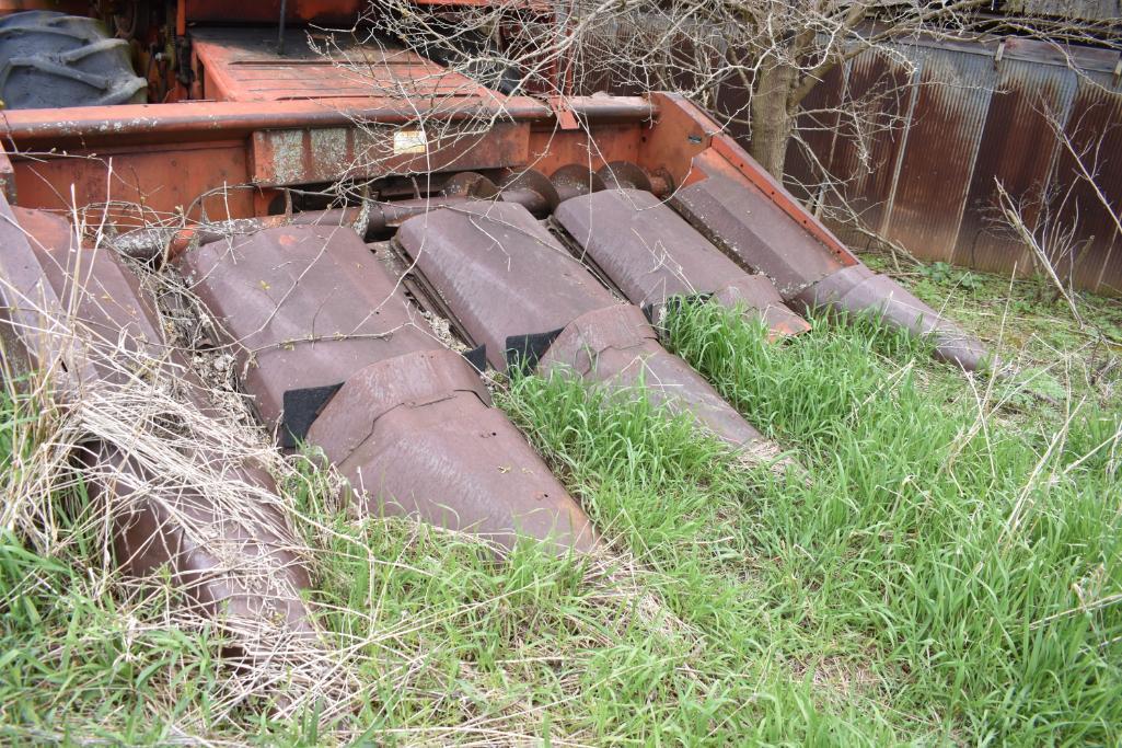 MF combine, salvage- sells w/ partial rack of weights sitting under it