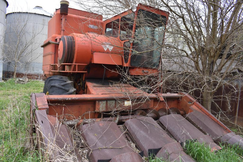 MF combine, salvage- sells w/ partial rack of weights sitting under it