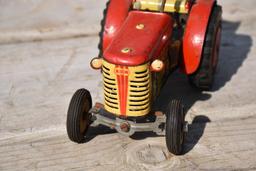 Early wind up tin tractor