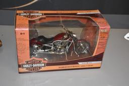 (2) Motorcycle advertising items to include 2004 V-Rod Harley Davidson die cast