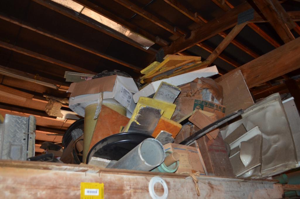 Contents in balcony area at south end of building including used diamond tread truck toolboxes, down
