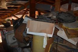 Contents in balcony area at south end of building including used diamond tread truck toolboxes, down