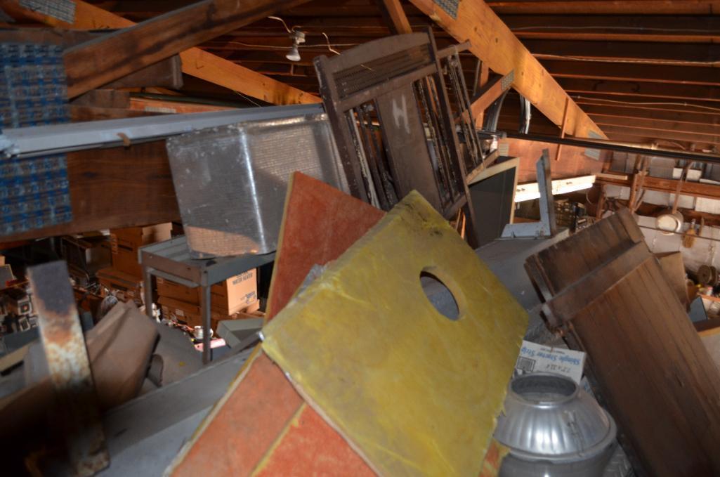 Contents in balcony area at south end of building including used diamond tread truck toolboxes, down