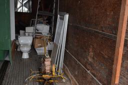 Contents of north storage trailer: toilets, concrete power trowel as is, marble, Please note new