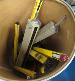Group That Includes Pipe Clamp, Minisafe-b And Almost Full Barrel Of Glass