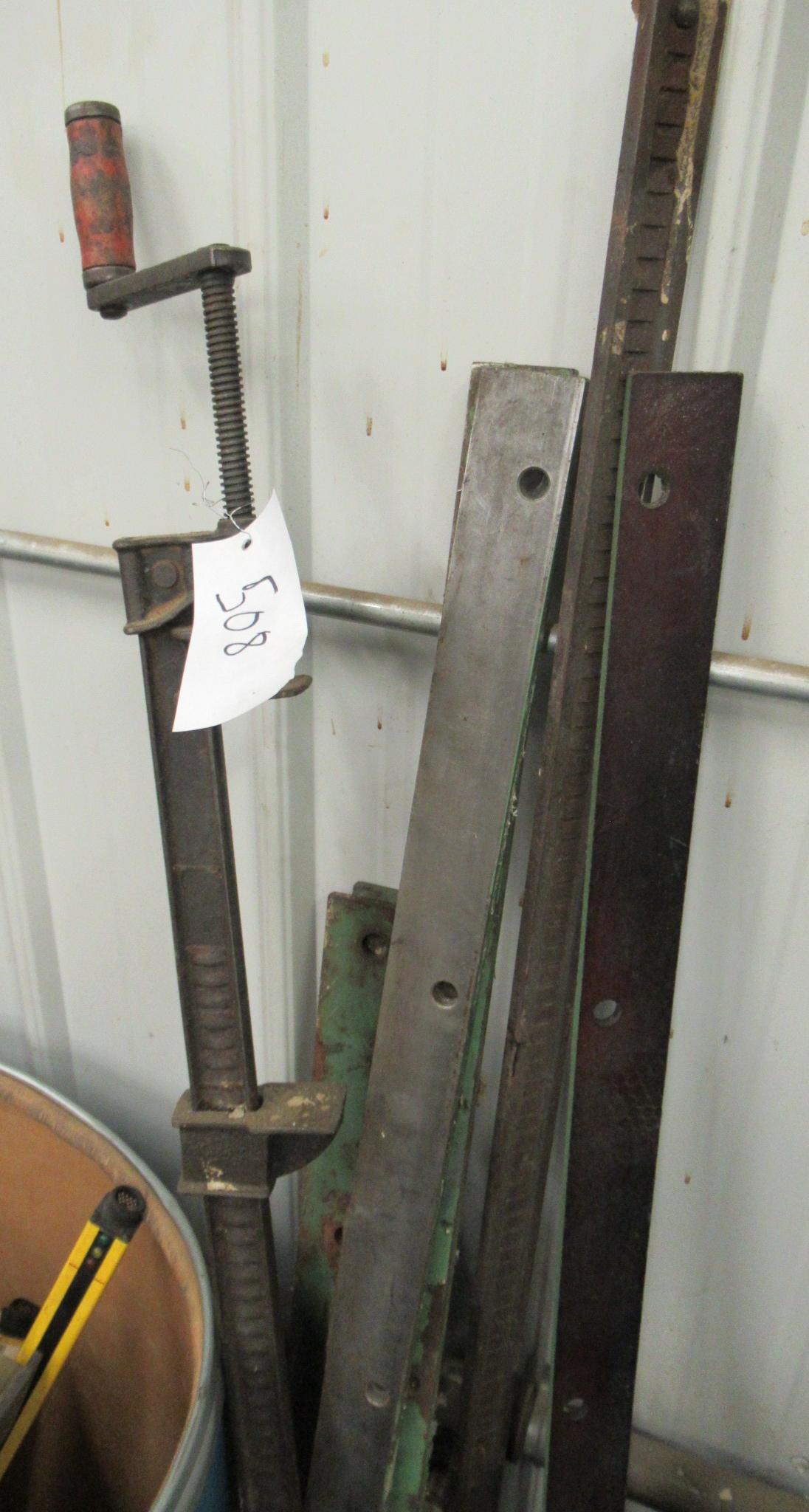 Group That Includes Pipe Clamp, Minisafe-b And Almost Full Barrel Of Glass