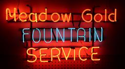 Soda Fountain Neon Sign, "Meadow Gold Fountain Service", orange & blue neon, c.194