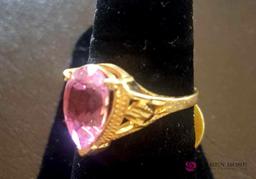 Ladies 14 karat gold ring with pink stone