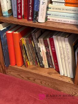 Upstairs, two shelves of books
