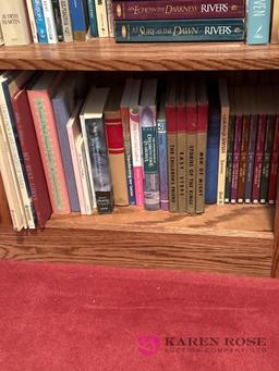 Upstairs, two shelves of books