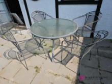 Forty eight inch round patio table with four chairs