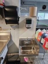 Hand washing station with soap and towel dispenser