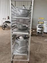 End load bun pan rack with various aluminum pots and strainers