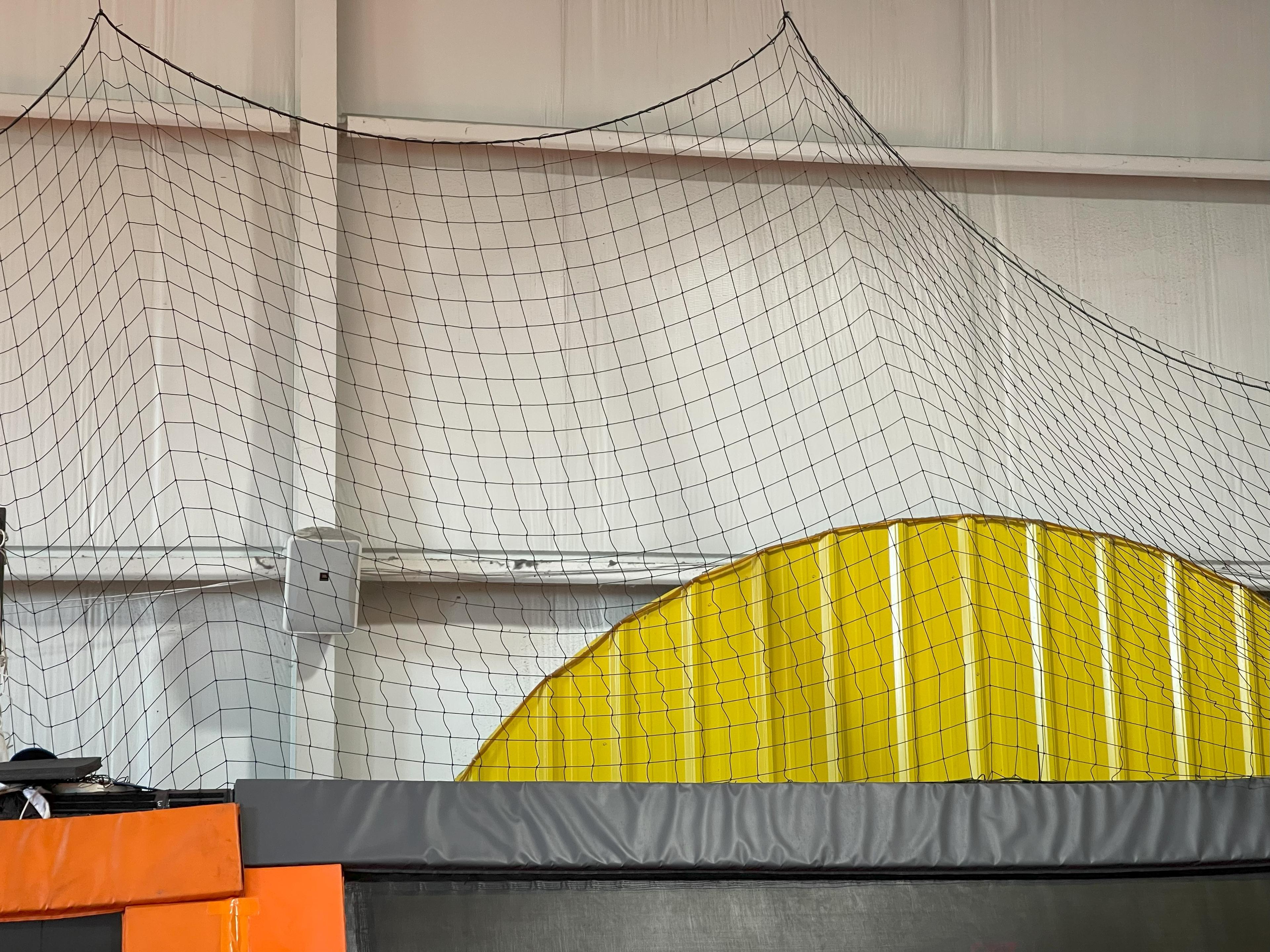 small trampoline system or dodgeball court with netting