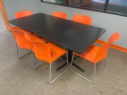 (2) black pedestal dining tables with (6) orange chairs