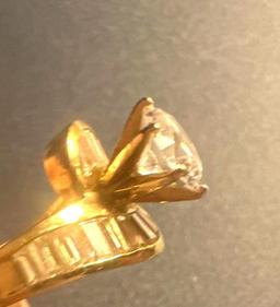 14 karat ring, 4.7 g total weight CZ diamond.