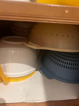 2 contents of kitchen cabinets measuring cups strainers pans and more