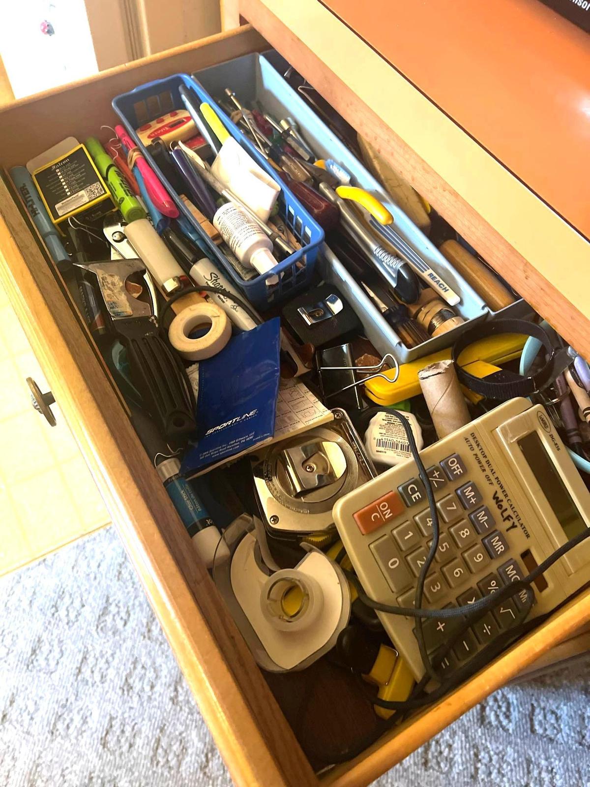 contents of kitchen drawer pens tape and more