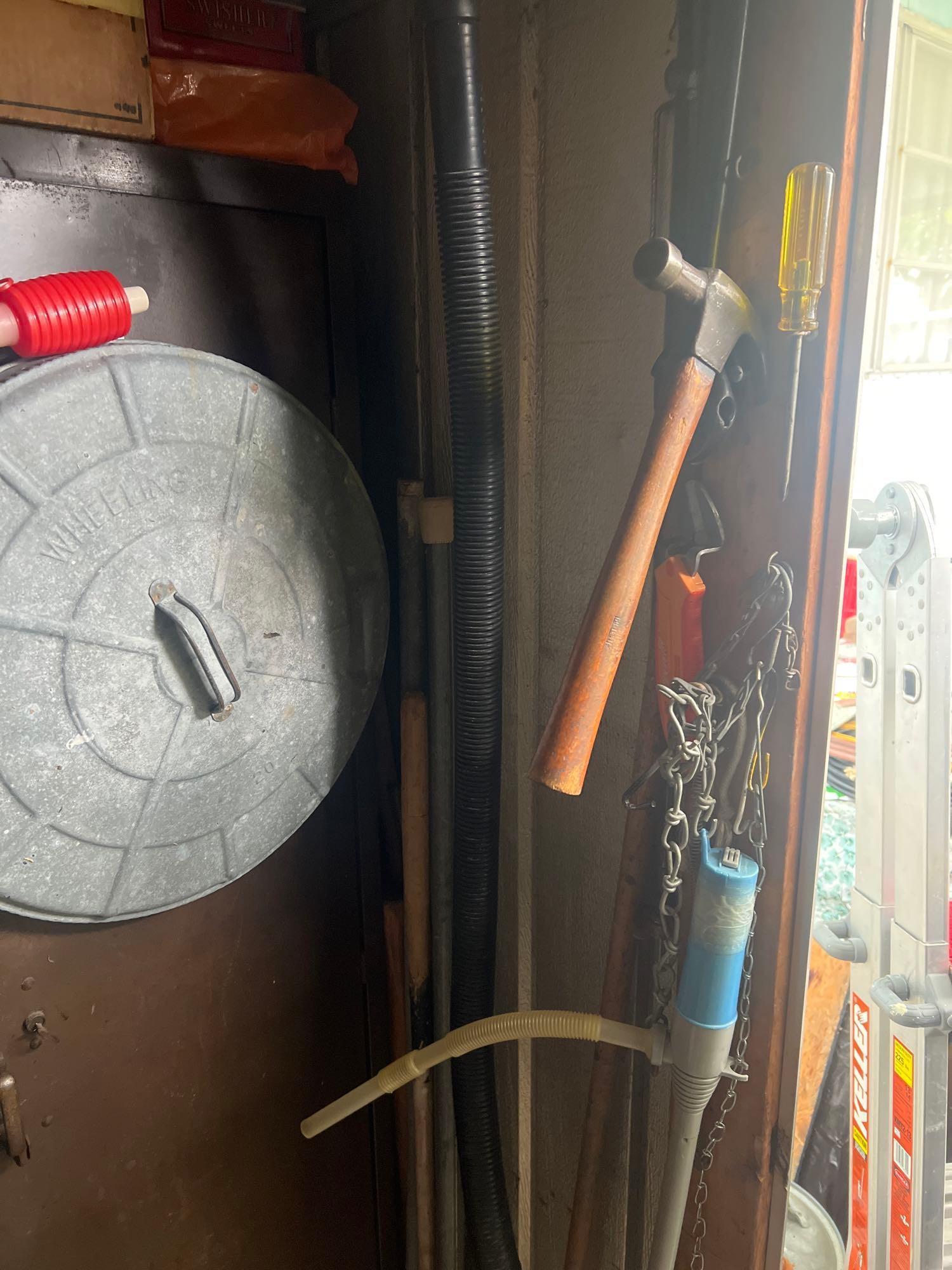 Metal cabinet with contents in shed