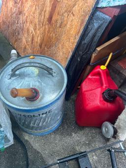 Gas tanks, propane tank, and crates in shed