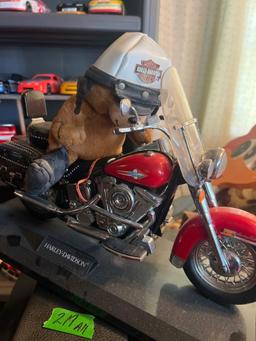 2 collector motorcycles, one Harley one wooden