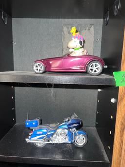 Shelf with collectors cars and motorcycles