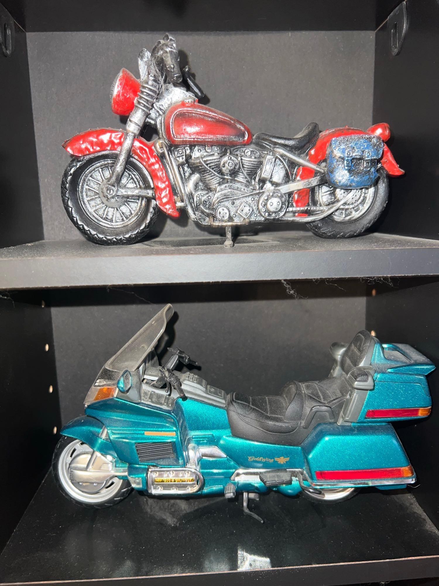 Shelf with collectors cars and motorcycles