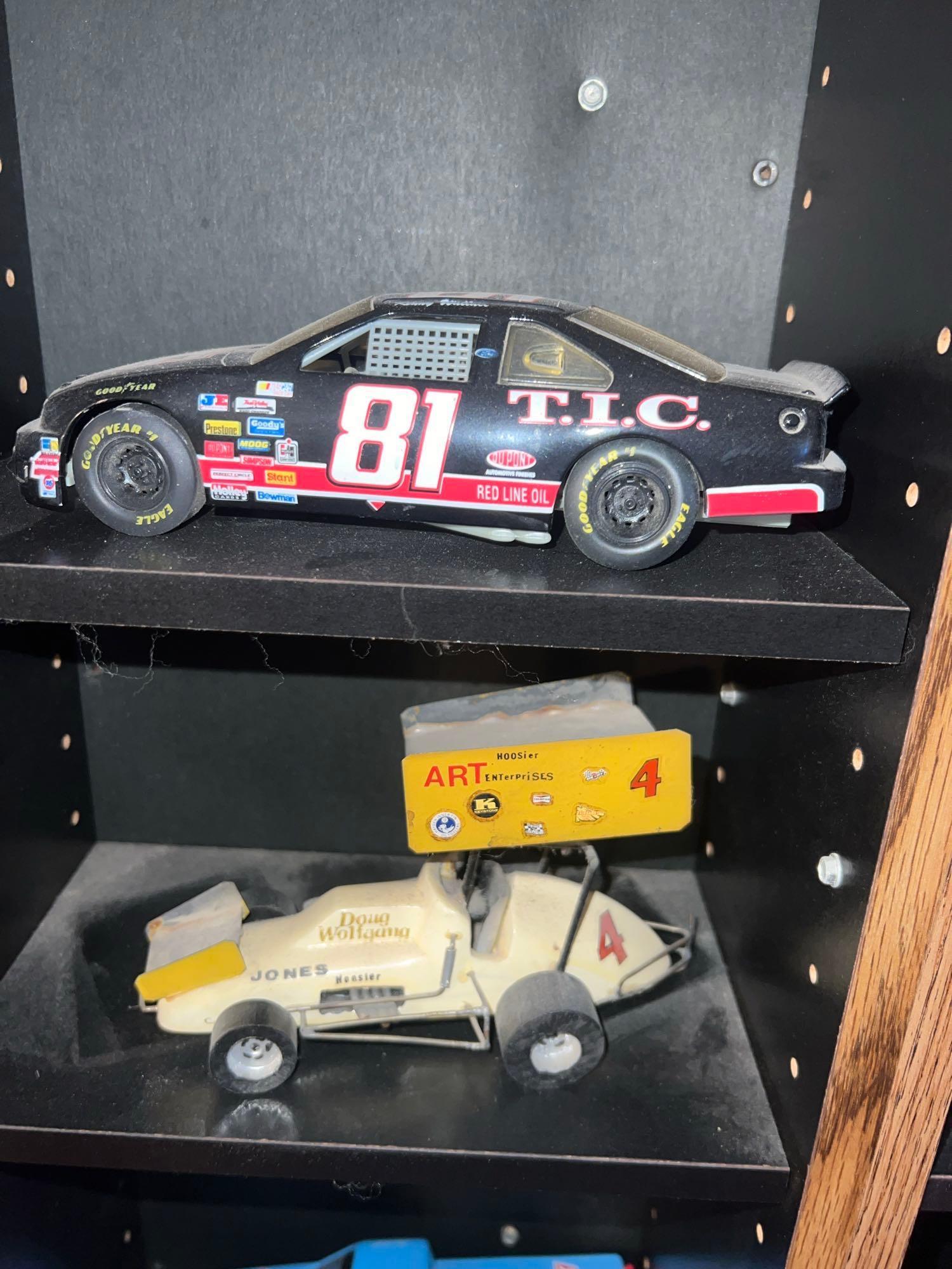Shelf with collectors cars and motorcycles