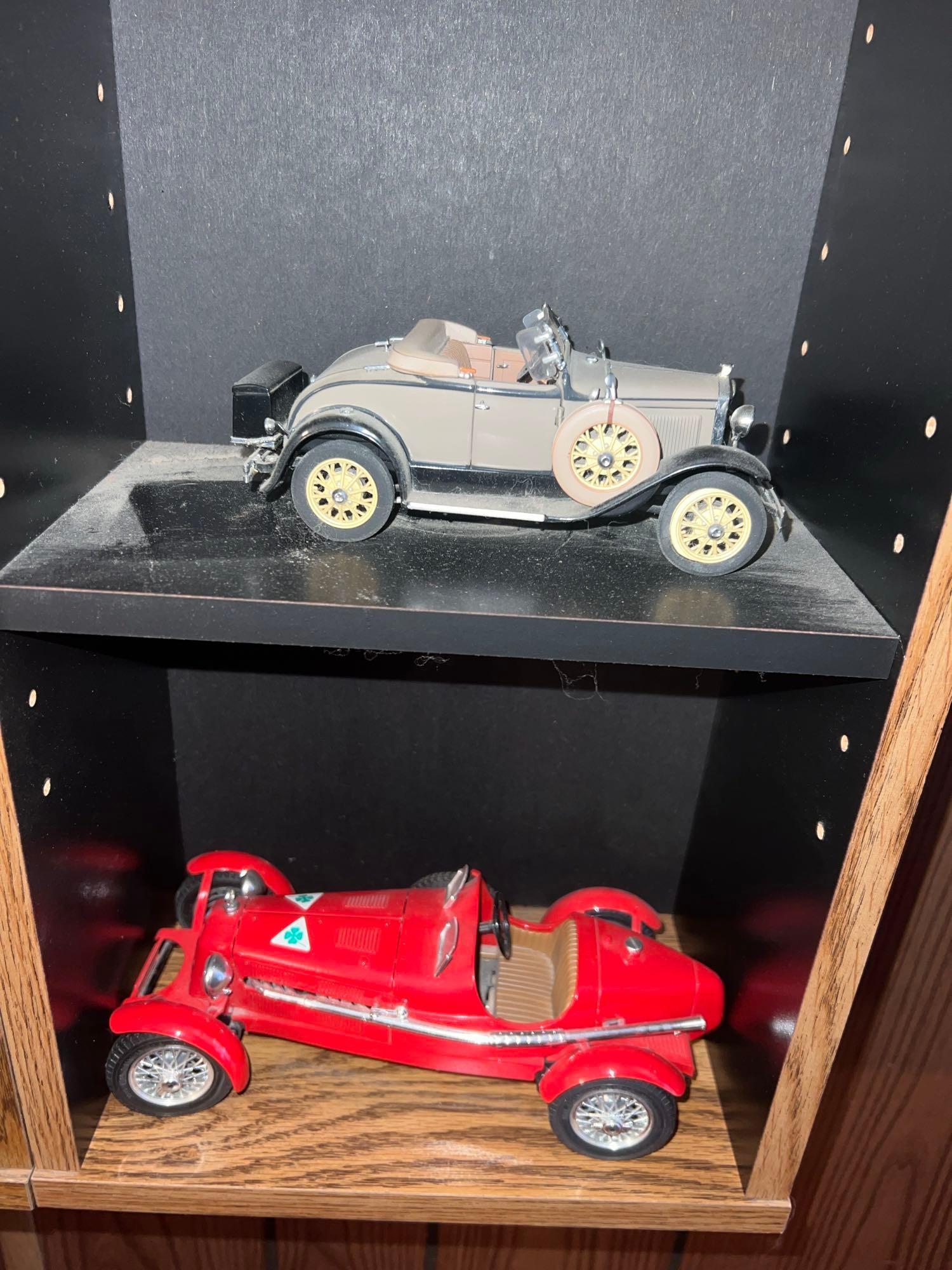 Shelf with collectors cars and motorcycles