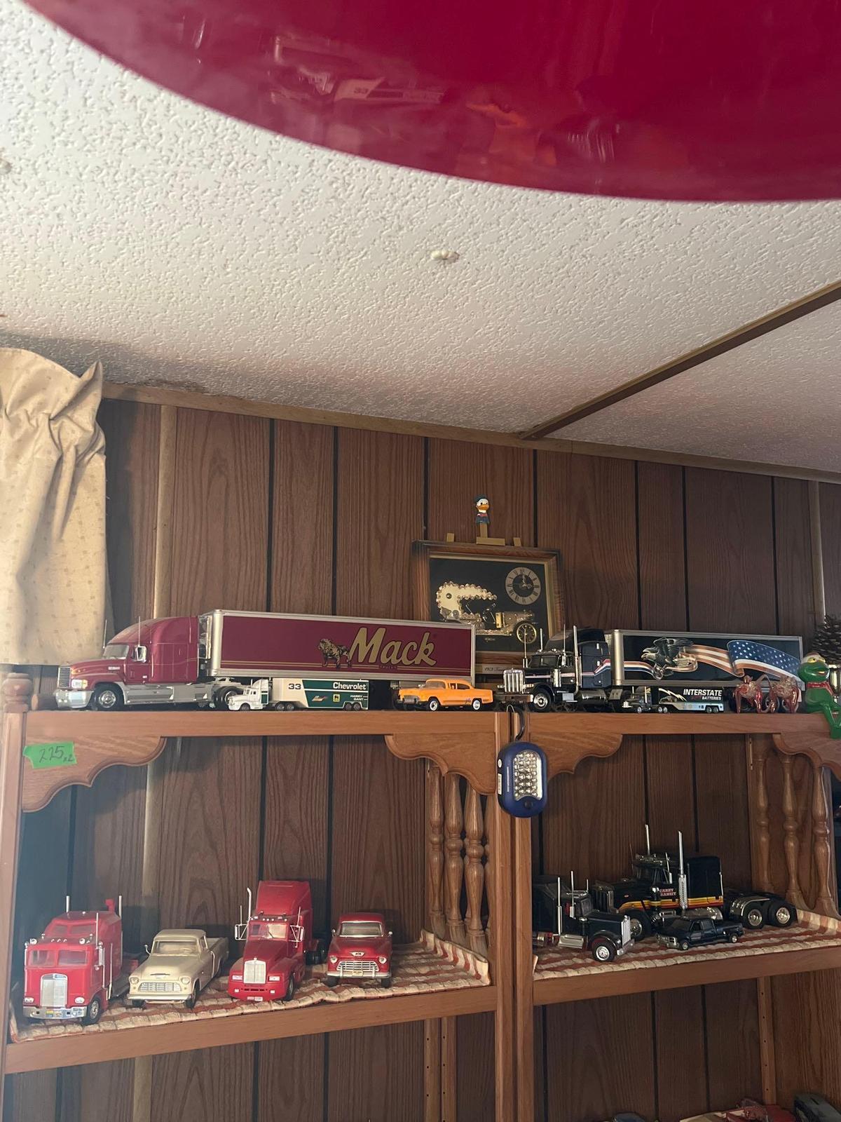 Shelf of collectors semi trucks and knickknacks