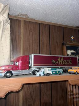 Shelf of collectors semi trucks and knickknacks