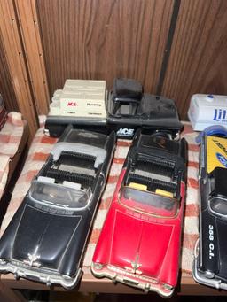 Shelf of collectible cars and car banks
