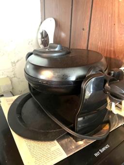 Air fryer and waffle maker in kitchen