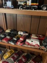 Shelf of collectible cars and car banks