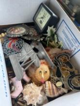 Lot of assorted decor and clock in kitchen