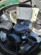 Trash can full of pvc fittings