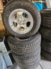 Set of dunlop P 235/60R15 tires on Aluminum wheels