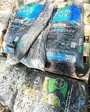 Black mulch and rubber nuggets, approximately six bags